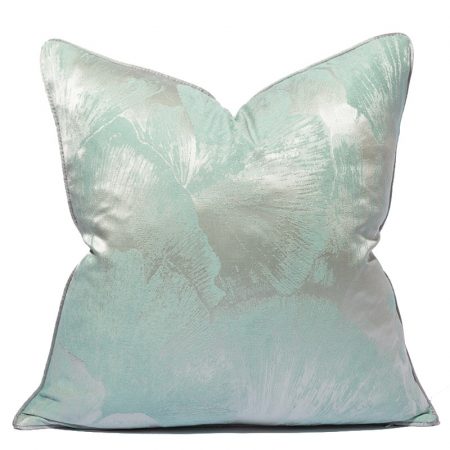 Decorative pillow with a light blue floral design.